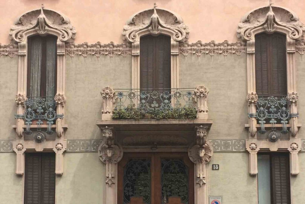 Elegant art nouveau entrance in a buidling in Porta Venezia, Milan, Italy.