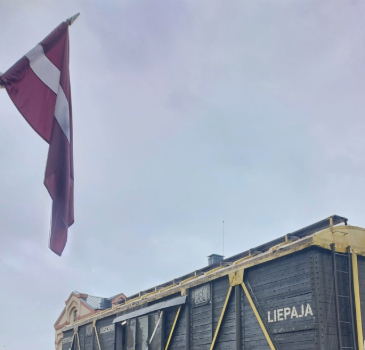 Latvian flag and train in the Museum of the Riga Ghetto and Holocaust in Latvia.