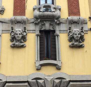 A window. In the Lombard capital, art nouveau, called Stile Liberty in Italian, found—thanks to its close relationship with the rampant industrial bourgeoisie of the time—a fertile ground for its rapid development, during which it oscillated between the influences of French Art Nouveau, German Jugendstil and eclecticism.