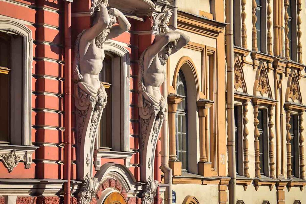 Street image in St Petersburg under a sunny day. Two sculptures.